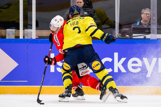Tristan Scherwey of Switzerland and Christian Folin of
