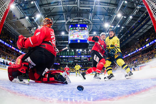 Joakim Nygård of Sweden (not in picture) shoots 1-0 and