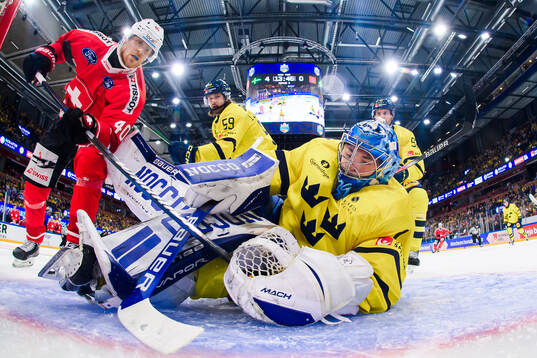 André Heim of Switzerland and goalkeeper Filip Larsson of