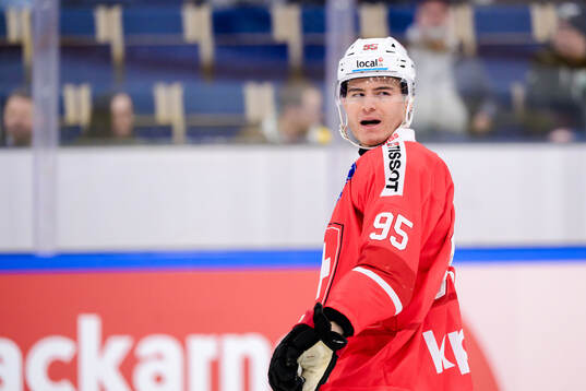 Tyler Moy #95, SUI of Switzerland looks dejected