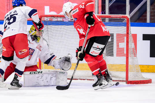 goaltender Jakub Málek of Czech Republic and Axel Simic of