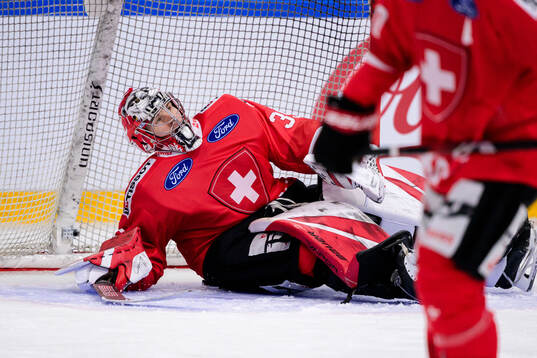 Goalkeeper Connor Hughes of Switzerland looks dejected