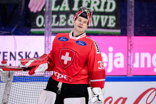 Goalkeeper Connor Hughes of Switzerland looks dejected