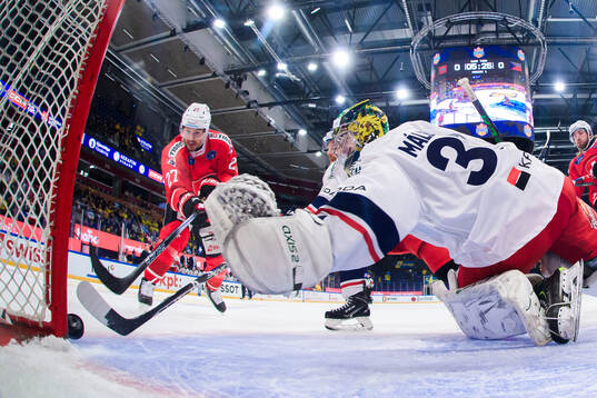Axel Simic of Switzerland shoots 1-0