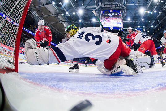 Axel Simic of Switzerland shoots 1-0