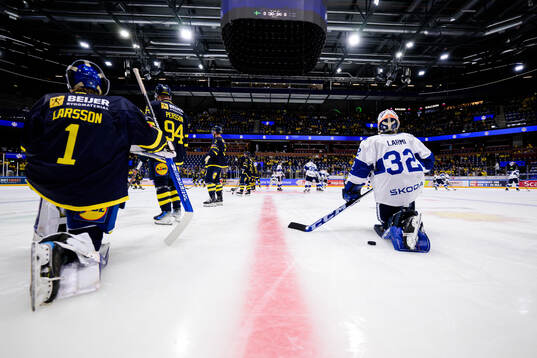 goalkeeper Filip Larsson of Sweden and goaltender Emil