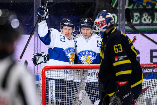 Eemeli Suomi and Sebastian Repo of Finland celebrate