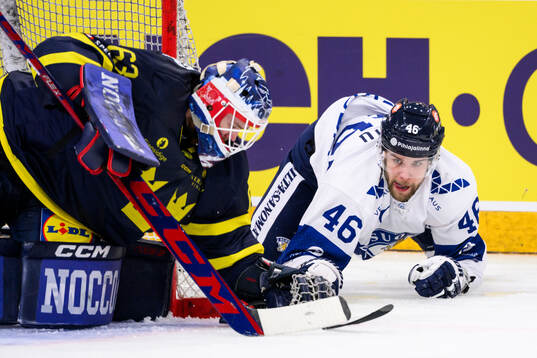 goalkeeper Marcus Högberg of Sweden and Joona Luoto of