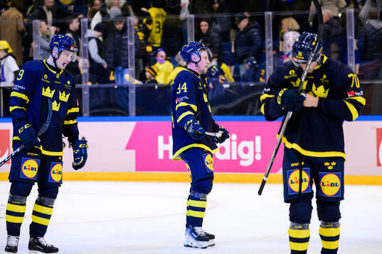 Gabriel Carlsson and Joel Persson of Sweden looks dejected