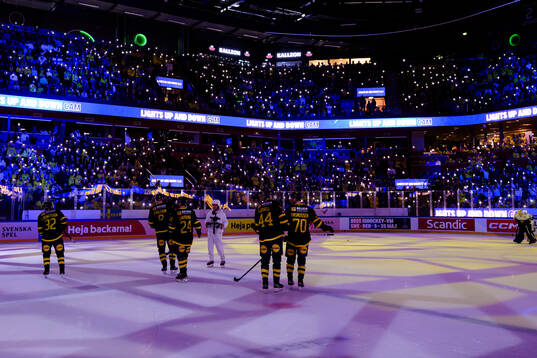 Lights from mobile phones lights up the arena
