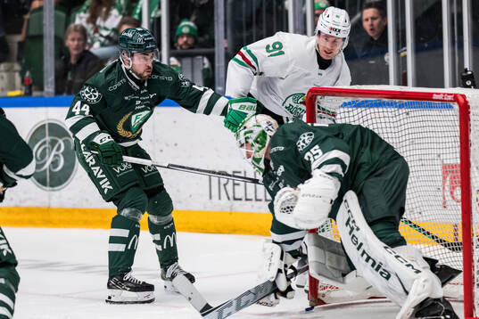 Färjestads Jonathan Andersson och Rögles Adam Tambellini