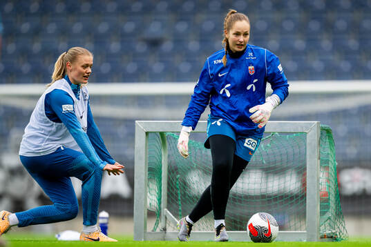 Mathilde Harviken and goalkeeper Aurora Mikalsen of the