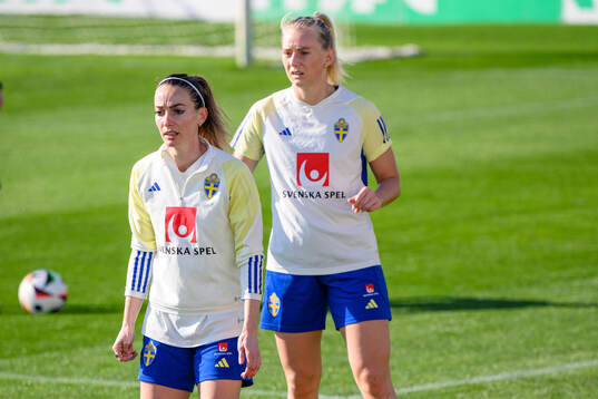 Kosovare Asllani and Stina Blackstenius of Sweden of the