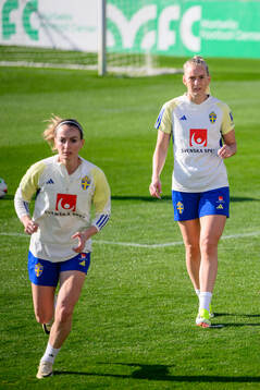 Kosovare Asllani and Stina Blackstenius of Sweden of the