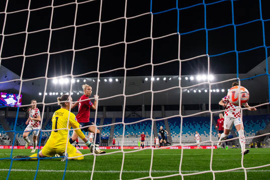 Celin Bizet Ildhusøy of Norway scores the 0-3 goal behind