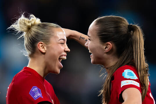 Celin Bizet Ildhusøy and Guro Reiten of Norway celebrate