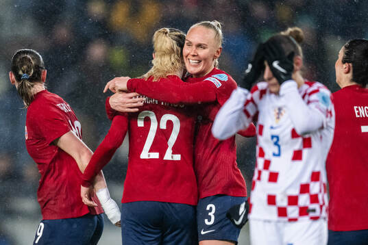 Sophie Roman Haug and Maria Thorisdottir of Norway celebrate