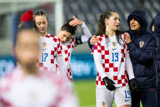 Karla Jedvaj and Tea Vračević of Croatia looks dejected