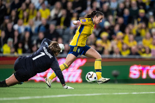 Rusul Rosa Kafaji of Sweden scores 3-0 behind  goalkeeper