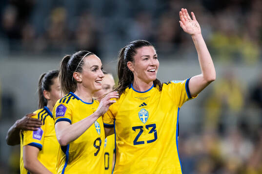 Kosovare Asllani and Pauline Hammarlund of Sweden celebrate