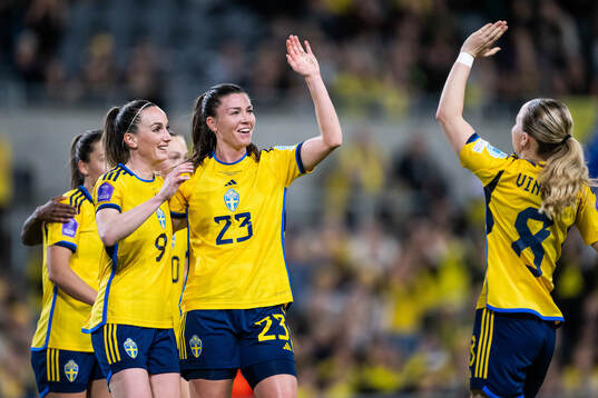 Kosovare Asllani and Pauline Hammarlund of Sweden celebrate