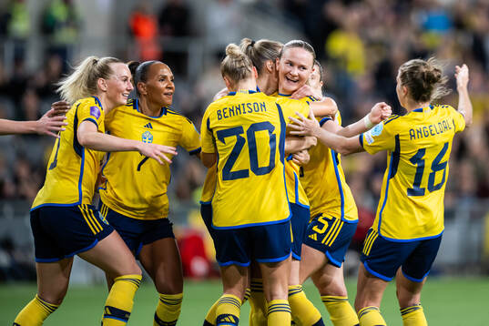Matilda Vinberg of Sweden (middle) celebrates with Stina