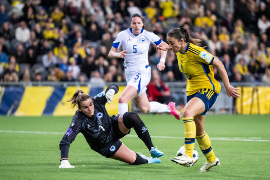 Rusul Rosa Kafaji of Sweden scores 3-0 behind goalkeeper