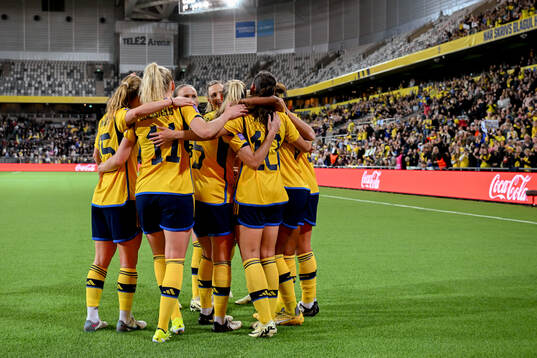 Rusul Rosa Kafaji of Sweden celebrates with teammates