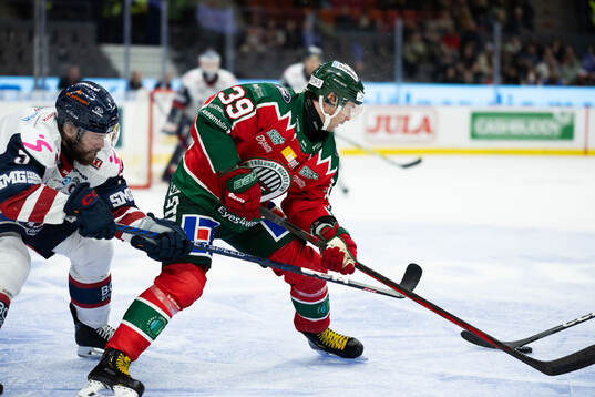 Linköpings Oscar Fantenberg och Frölundas Mikael Ruohomaa