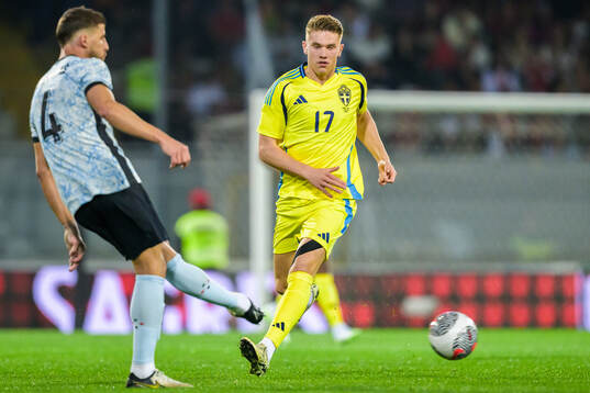Ruben Dias of Portugal and Viktor Gyökeres of Sweden