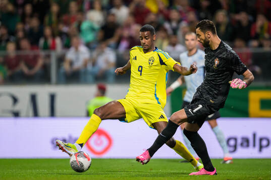 Alexander Isak of Sweden and goalkeeper Rui Patricio of