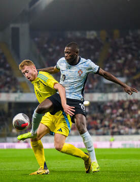 Dejan Kulusevski of Sweden and Nuno Mendes of Portugal