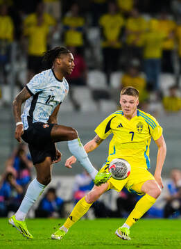Rafael Leao of Portugal and Emil Holm of Sweden