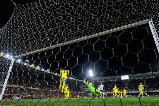 Goalkeeper Robin Olsen of Sweden lets in the 1-0 goal by