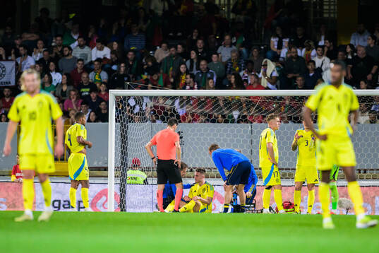 Mattias Svanberg of Sweden receives medical attention