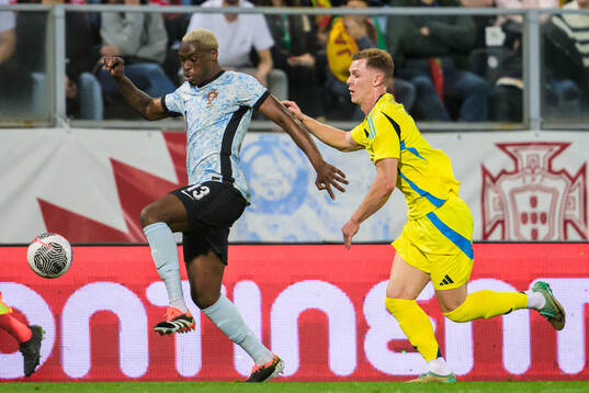 Tote Gomes of Portugal and Emil Krafth of Sweden