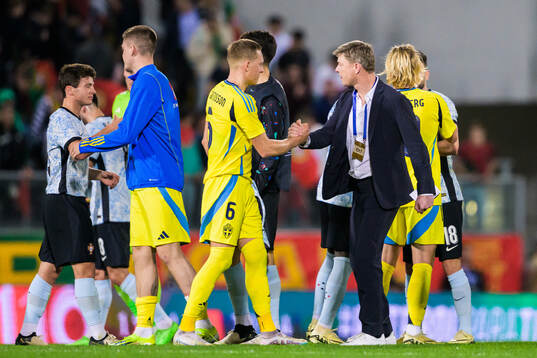 Ludwig Augustinsson and head coach Jon Dahl Tomasson of