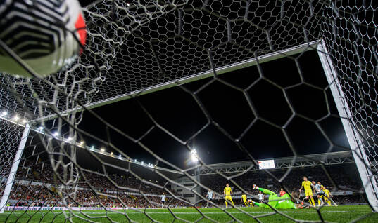 Matheus Nunes of Portugal scores 2-0 behind goalkeeper