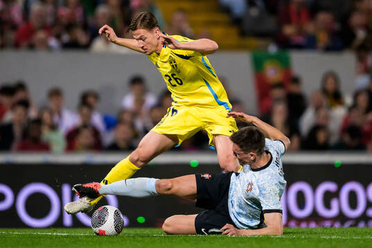 Simon Olsson of Sweden and Joao Palhinha of Portugal