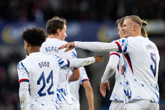 Oscar Bobb celebrate with Erling Braut Haaland of Norway