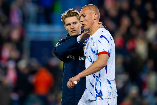 Martin Ødegaard and Leo Østigård of Norway look dejected