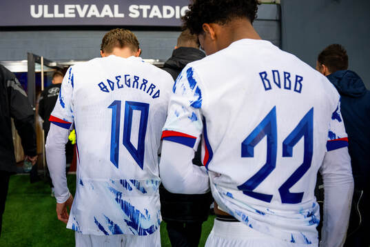 Martin Ødegaard and Oscar Bobb of Norway at half-time