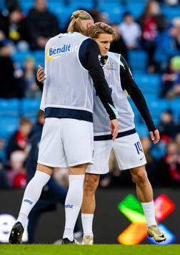 Erling Braut Haaland and Martin Ødegaard of Norway warm up