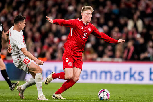Granit Xhaka of Switzerland and Rasmus Højlund of Denmark