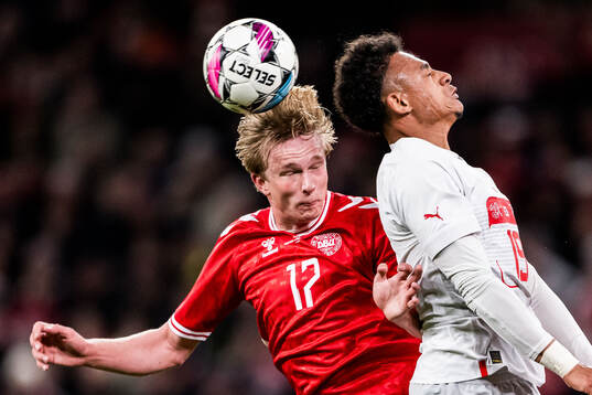 Victor Kristiansen of Denmark and Dan Ndoye of Switzerland