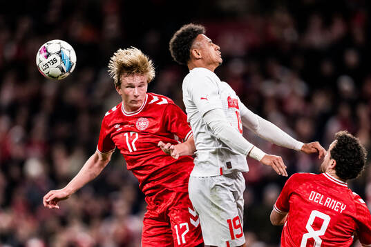 Victor Kristiansen of Denmark and Dan Ndoye of Switzerland