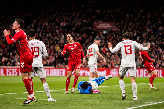 Yussuf Poulsen of Denmark looks dejected