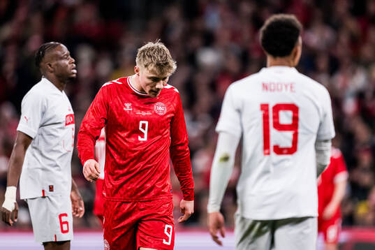 Rasmus Højlund of Denmark looks dejected