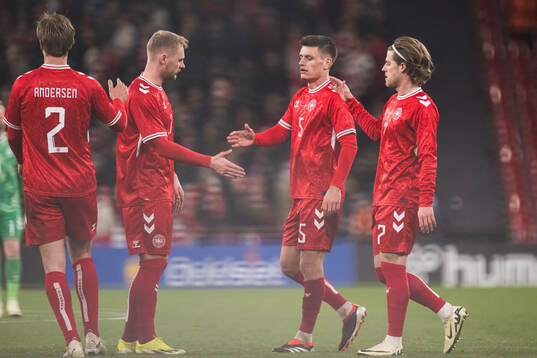 Joakim Mæhle and Mathias Jensen of Denmark looks dejected