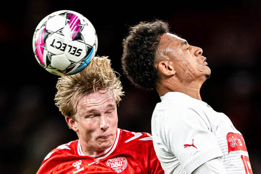 Victor Kristiansen of Denmark and Dan Ndoye of Switzerland